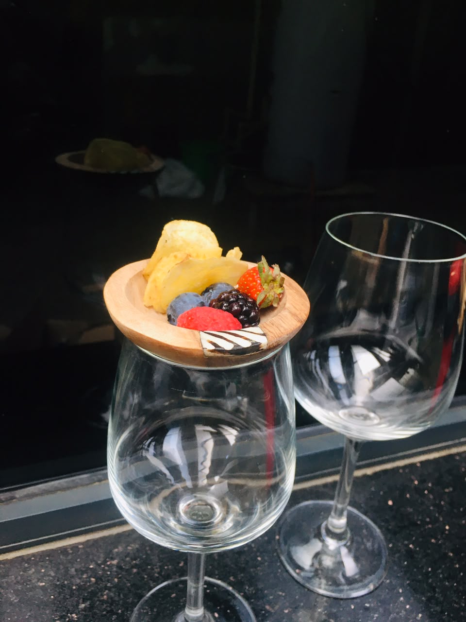 African wood wine glass topper at Pride Inn Hotels